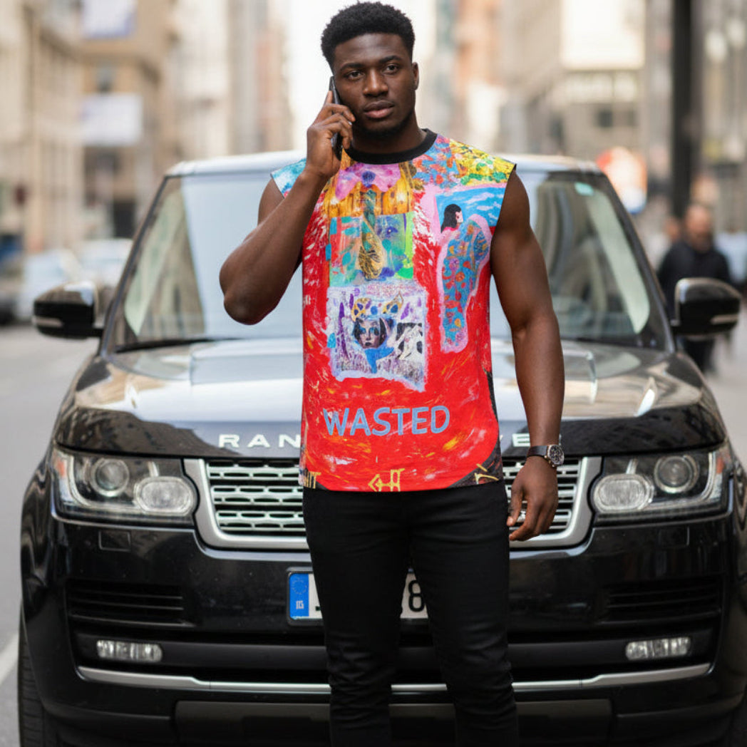 A man stands in front of a black SUV on a city street, holding a phone to his ear. He is wearing a sleeveless bright red graphic top with multicolored artwork and the word 'WASTED' on the front, paired with black pants.