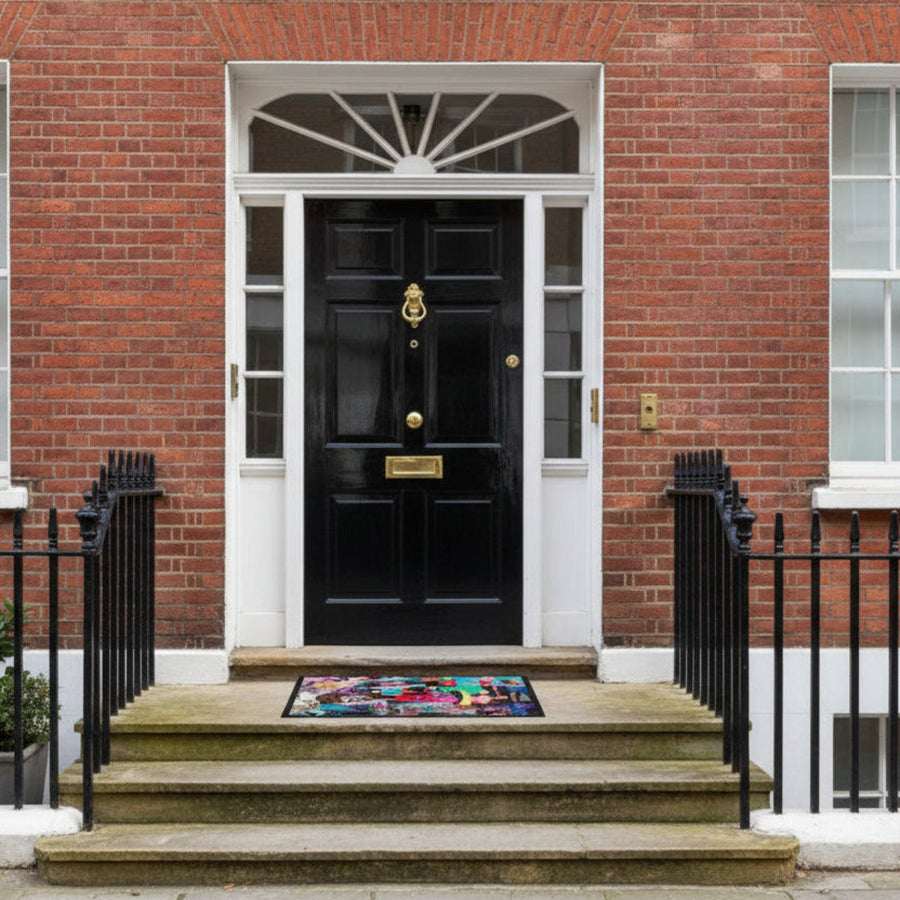 A multicolored geometric patterned doormat with various design elements such as fashion models, animals, and abstract shapes.