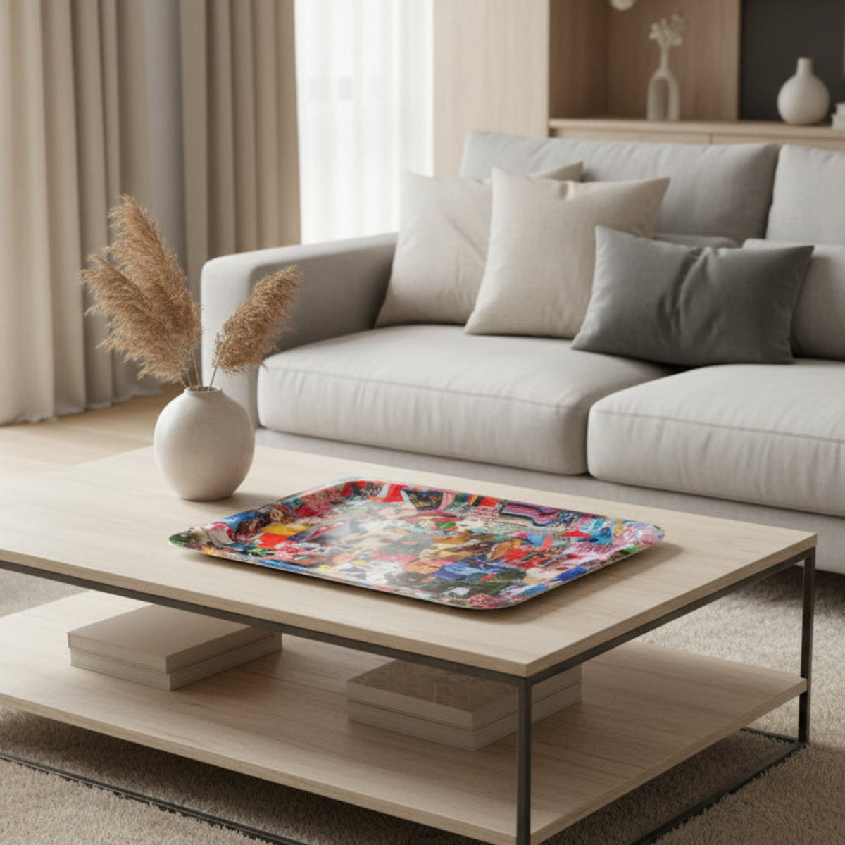 Modern living room with a light gray sofa, coffee table, and decorative items.